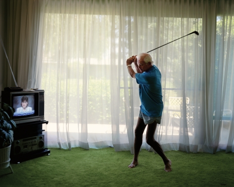 Practicing Golf Swing, from the series Pictures from Home, 1986. Chromogenic print, image: 14 3/4&nbsp;x 18 1/2&nbsp;inches.&nbsp;